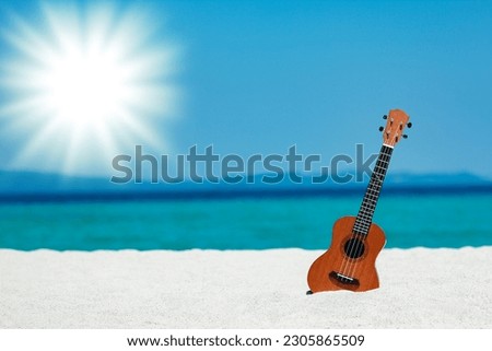 beautiful guitar on the sand by the Greek sea