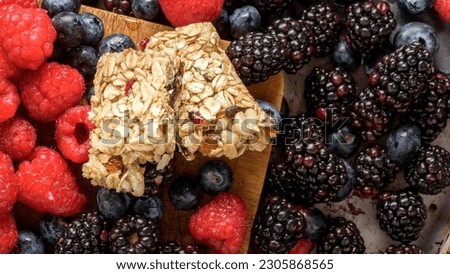 Berry Blast: Up-Close View of Energy Bar with Luscious Berries in the Background
