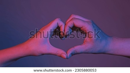 Female and male hands in form of heart. Hands in shape of love heart. Heart from hands . Love, friendship concept. Man and woman hand in hearts form love. Sign heart by fingers. Love on Valentine day.