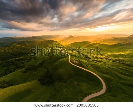 Panoramic view of the green mountains at sunset. Gumbashi Pass in North Caucasus, Russia. Summer landscape