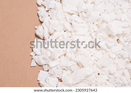 Full frame of soy wax flakes for candle making on brown bakground Royalty-Free Stock Photo #2305927643