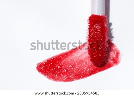 Lip gloss. Lip gloss red   sample.  Royalty-Free Stock Photo #2305954585