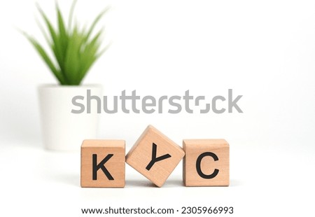 KYC - letters on wooden cubes. concept on cubes on white background. Business as usual concept image. KYC - short for know your customer our client.                     