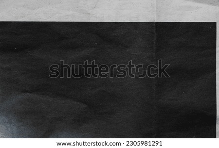 folded news paper overlay, dark ink on thin copy paper. photo layer. Royalty-Free Stock Photo #2305981291