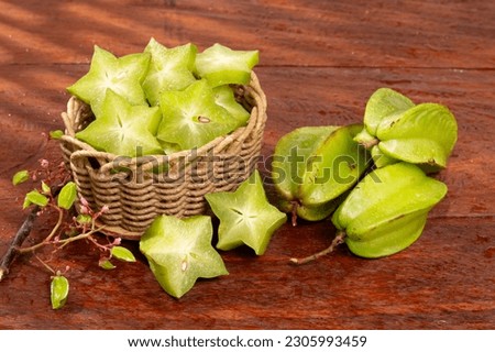 Star fruit or Carambola Green - Averrhoa Carambola; Photo On Wooden Background