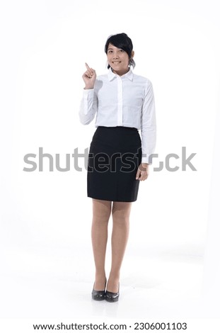 Full length image of business woman with finger to side over white background