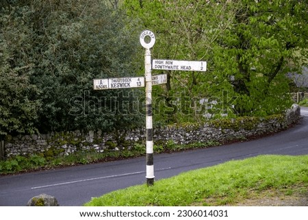A signpost in Dockray in the Lake District, Cumbria, UK