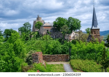 Schlossberg mountain with church and historical Saarburg castle ruin Royalty-Free Stock Photo #2306034359