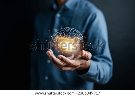 Hand holding virtual human brain and golden key icon, idea creative intelligence to success business goal concept. Royalty-Free Stock Photo #2306049917