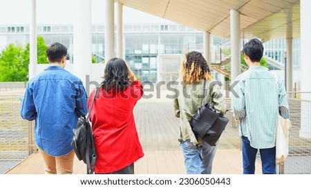Multinational youth group walking in college campus. College students. Royalty-Free Stock Photo #2306050443