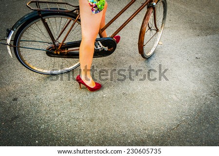 Colorful photography of a woman in a bike in the city