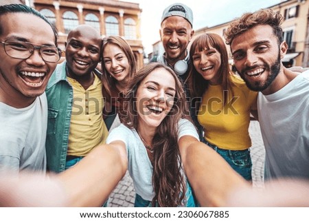 Multiracial best friends taking selfie pic with smart mobile phone outside - Group of young people having fun on summer vacation - Friendship concept with guys and girls hanging out together 