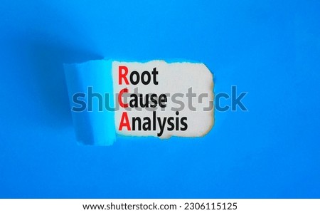 RCA root cause analysis symbol. Concept words RCA root cause analysis on beautiful white paper. Beautiful blue table blue background. Business and RCA root cause analysis concept. Copy space.