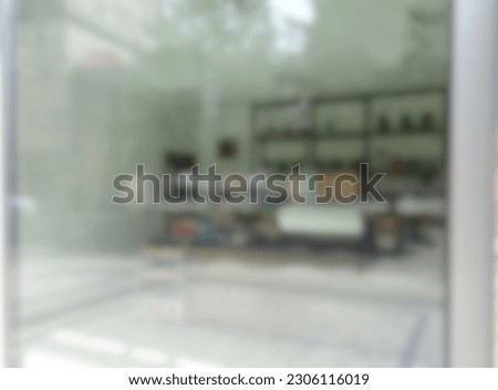 Defocused and blurred modern front window of a cafe, restaurant, bar or store with blank space background