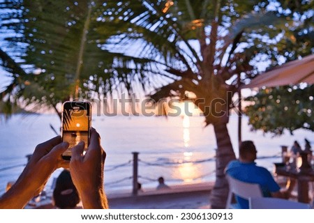 Beautiful sunset at the beau vallon beach, calm sea ans stunning colors, view the client phone, Mahe Seychelles Royalty-Free Stock Photo #2306130913