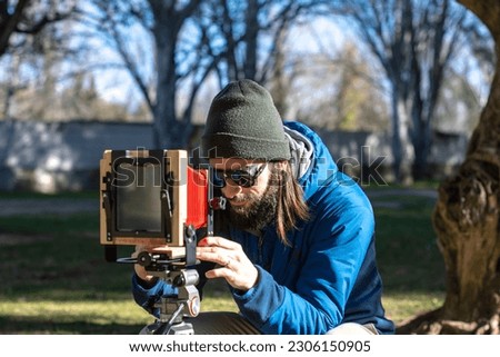 Photographer taking a photo with a large format camera