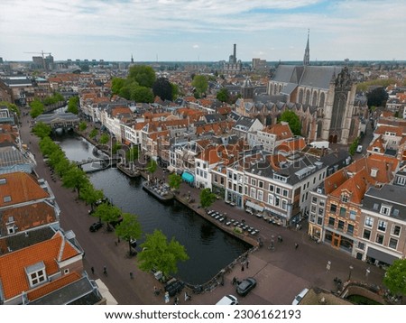 This aerial drone photo is made in Leiden, an old city in Zuid-Holland, the Netherlands. You can see the beautiful typical dutch canal houses.