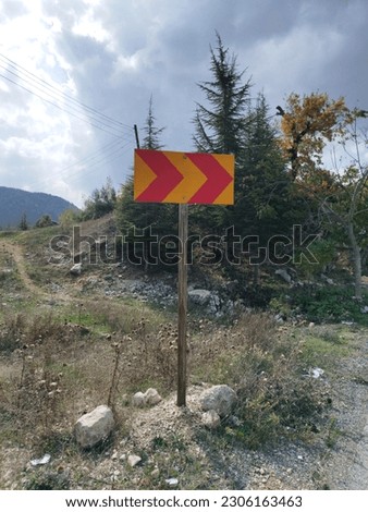 road sign, beside a road, high quality photo.