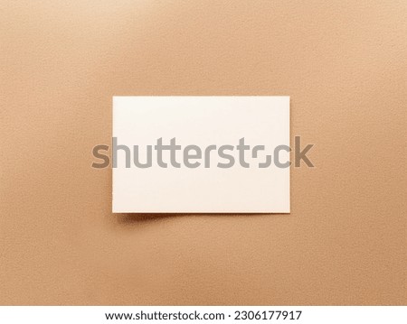 Blank card mockup on sand background. Top view. Minimal design