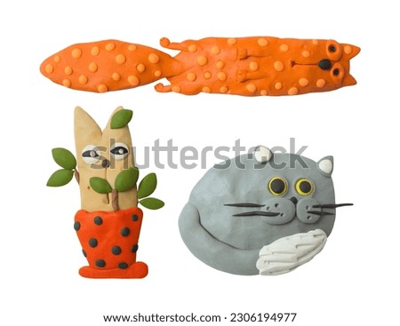 Handmade cartoon cats. Modeling clay. Funny pets.