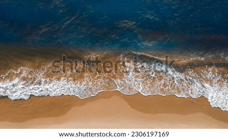Coast with waves as a background from top view. Blue water background from drone. Summer seascape from air. Travel - image Royalty-Free Stock Photo #2306197169