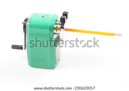 old green sharpener and colorful pencil isolated on white background