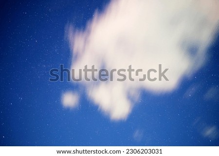 Clouds passing thru the blue sky during dawn
