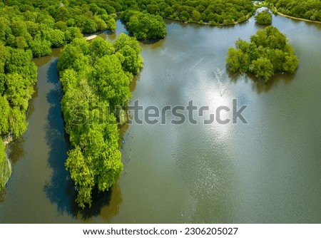 Aerial view of Connaught Water lake Epping park in Essex, England, UK