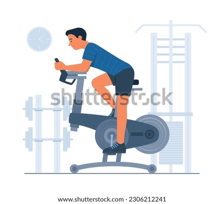Man Exercise with Spinning Bike in Gym