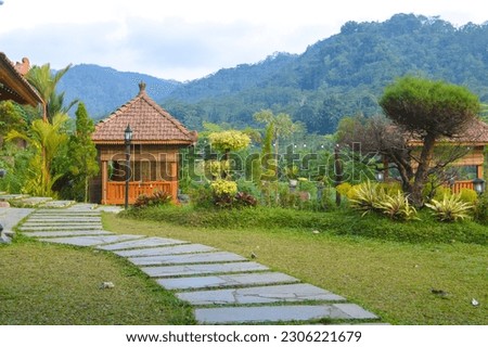 a place to relax with a beautiful garden set against the mountains
