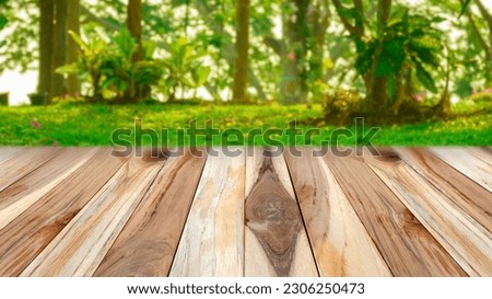 Empty wooden surface against  with forest trees and meadows background in springtime blur background , display podium for product mockups 3d trade show display advertising, For text and advertising.