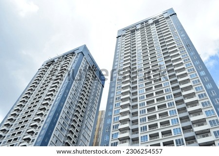 Tall building, city landmark, city skycraper apartment hotel, twin apartment hotel Royalty-Free Stock Photo #2306254557
