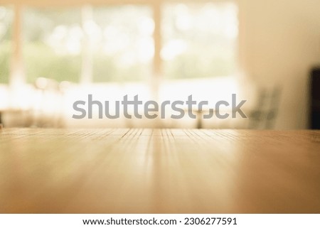 Wood table with blur kitchen room background .For montage product display or design key visual layout.