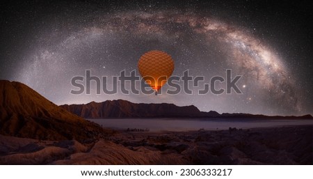 Beautiful night landscape with silhouette of Bromo mountain on the background Milkyway galaxy - Bromo Tengger Semeru National Park , Indonesia