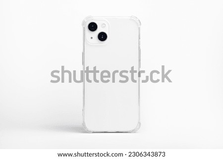 white iPhone 14 starlight in clear transparent soft silicone case back view. Phone case mockup isolated on grey background Royalty-Free Stock Photo #2306343873