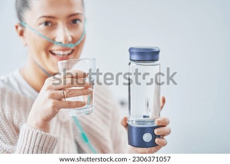 Picture of woman having hydrogen water in hand