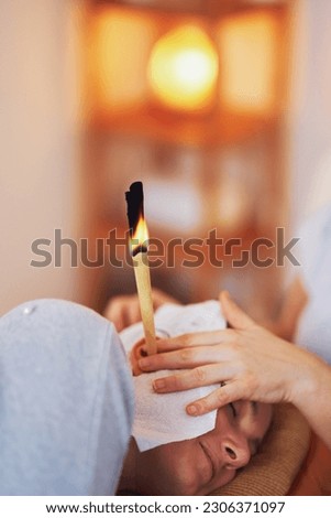 Picture of woman having candle therapy concha