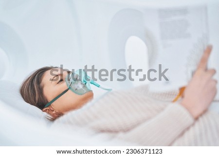 Picture of brunette woman in oxygen cabin Royalty-Free Stock Photo #2306371123