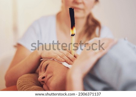 Picture of woman having candle therapy concha