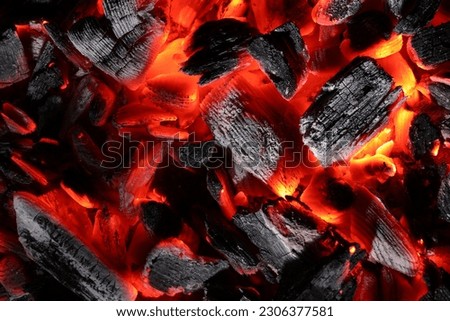 Pieces of hot smoldering coal as background, top view Royalty-Free Stock Photo #2306377581