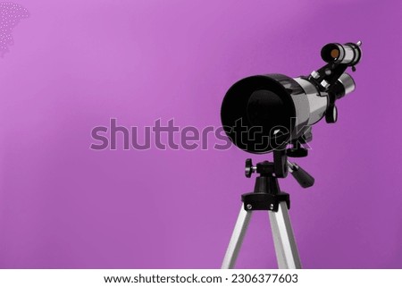 Tripod with modern telescope on purple background, closeup. Space for text