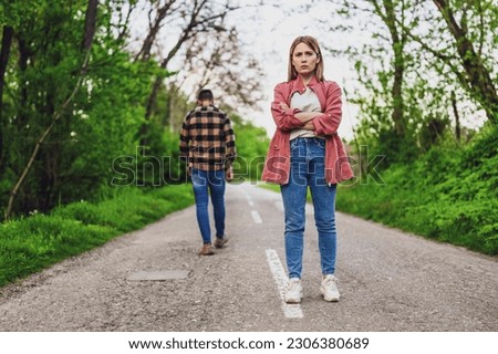 Couple is having difficulties in their relationship. Man is leaving his woman after argue. Conceptual image. Royalty-Free Stock Photo #2306380689