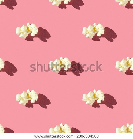 seamless pattern of tasty single popcorn on a pink background with hard light Royalty-Free Stock Photo #2306384503