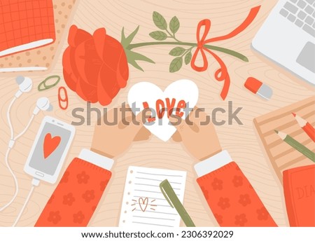 St. Valentine's Day greeting card. Vector illustration of school desk with hands holding valentine, rose, notebooks and laptop. Flat lay. Girl with greeting card.  Royalty-Free Stock Photo #2306392029