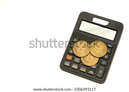 calculator and coin bitcoin isolated on white background, calculation of profitability.