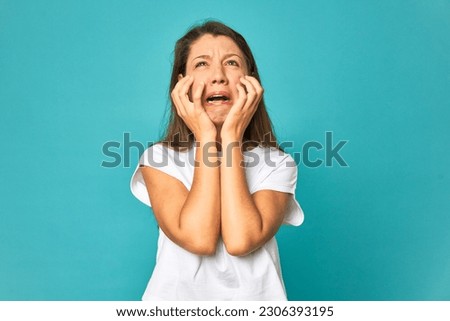 A young caucasian woman isolated whining and crying disconsolately. Royalty-Free Stock Photo #2306393195