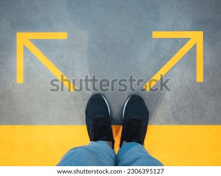 Man Standing with Arrow Direction Choice Left and Right Conceptual