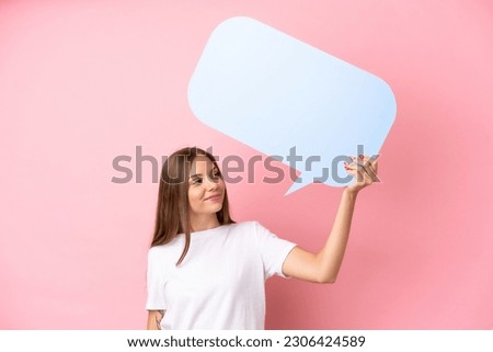 Young Lithuanian woman isolated on pink background holding an empty speech bubble Royalty-Free Stock Photo #2306424589