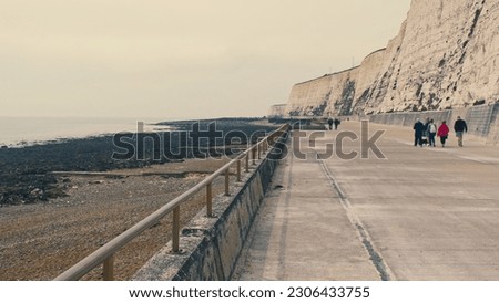 Walkway on Rottingdean Beach Cliff Coast with People Walking Along Royalty-Free Stock Photo #2306433755