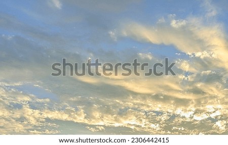 Beautiful sky with cloud before sunset. Blue sky background with tiny clouds. Panorama. Beautiful sunset cloudy sky from aerial view. Sky with clouds and sun.